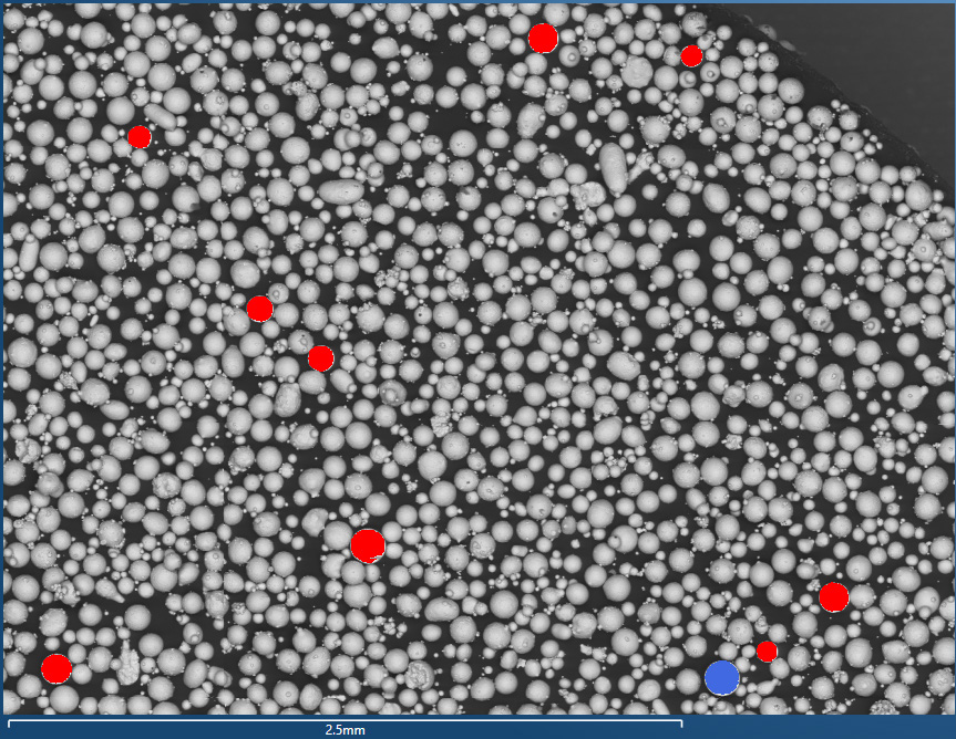 Fig. 3b – Contaminant particles detected, analysed and classified, shown in colour (red = W, blue = WO)